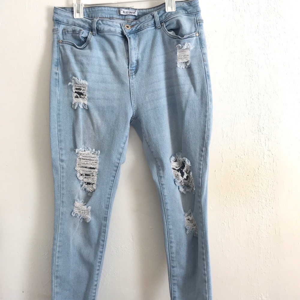 Size 20 light wash distressed denim skinny jeans.